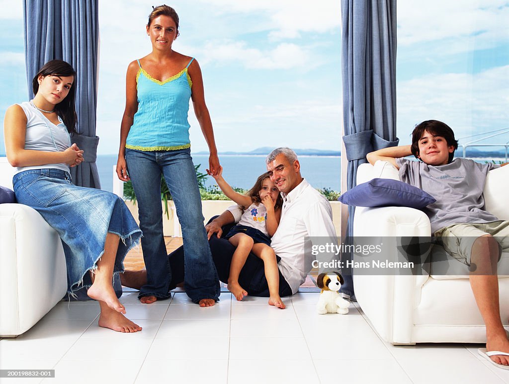 Parents and children (2-15) relaxing at home, portrait