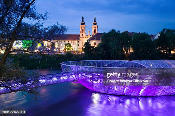 austria, graz, island of the mur at dusk - graz stock-fotos und bilder