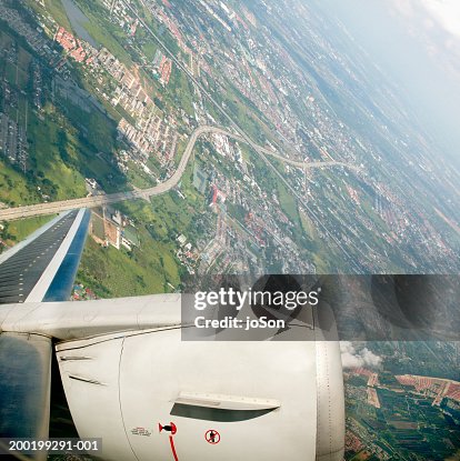 Fly Over Images Airplane Flying Over City Closeup Of Engine Aerial View High-Res Stock ...