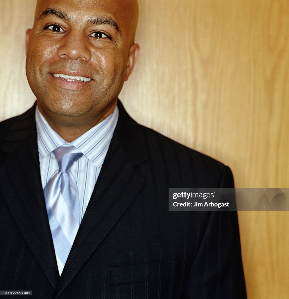 Mature businessman smiling, portrait