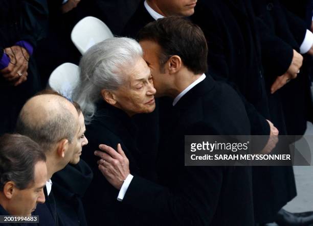 French President Emmanuel Macron greets Elisabeth Badinter, widow of the late former French justice minister Robert Badinter, prior to the start of a...