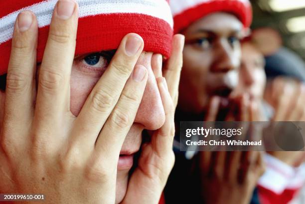 football supporters at match, close-up - fan stockfoto's en -beelden