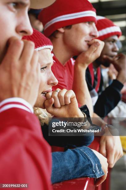 football supporters at match, biting nails, side view, close-up - cu fan stock pictures, royalty-free photos & images