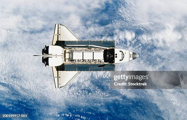 space shuttle orbiting earth, satellite view - nasa stockfoto's en -beelden