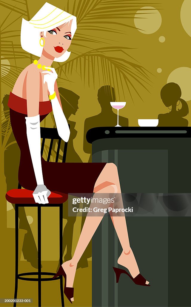 Woman sitting on stool at bar counter, legs crossed at knee