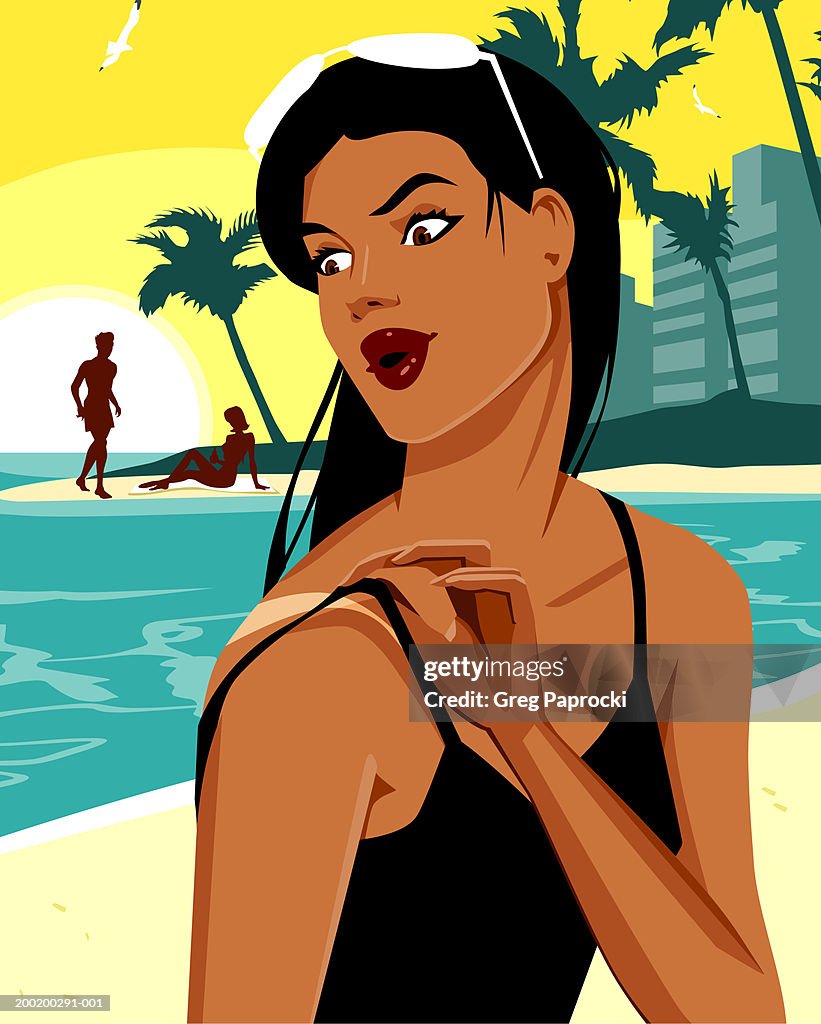 Woman on beach, looking at sunburned shoulder