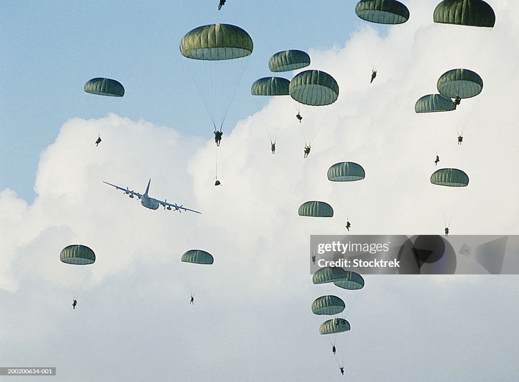 Soldiers parachuting after training jump from Lockheed C-130 Hercules