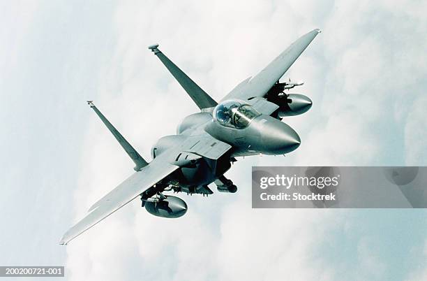 mcdonnell douglas f-15 eagle in flight during training mission - military plane stock pictures, royalty-free photos & images