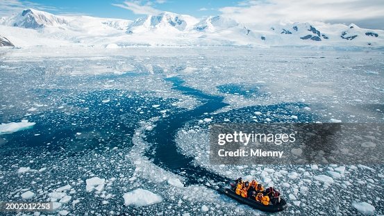 Explorer Team Returning from Antarctica Peninsula in Zodiac Dinghy Boat Explorer Team Returning from Antarctica Peninsula in Zodiac Dinghy Boat