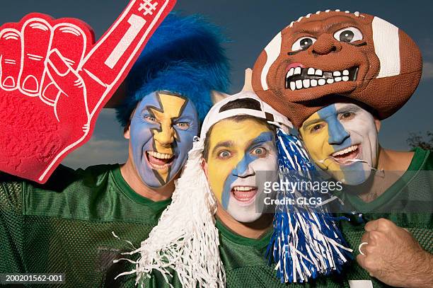 three male football fans wearing face paint, gesturing - face paint stock pictures, royalty-free photos & images