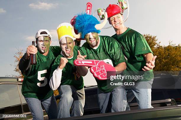 four male football fans wearing face paint, gesticulating - body paint stock pictures, royalty-free photos & images