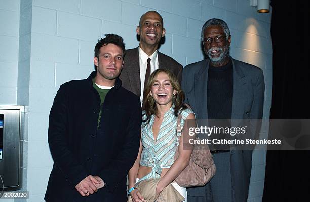 Bill Russel and Kareem Abdul-Jabbar pose with Jennifer Lopez and Ben Affleck as the Los Angeles Lakers host the San Antonio Spurs in Game four of the...