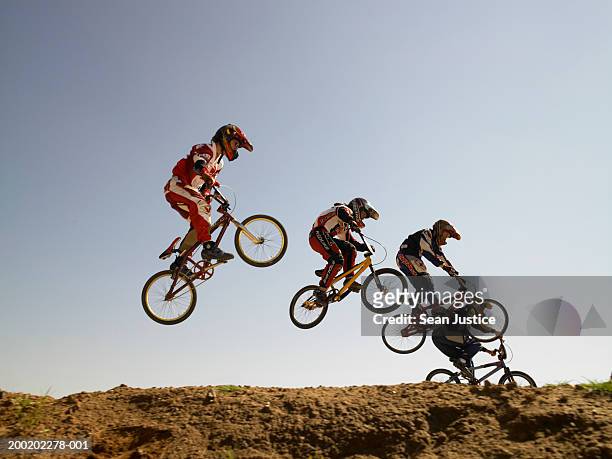 bmx cyclists in competition - sports race bicycle stock pictures, royalty-free photos & images