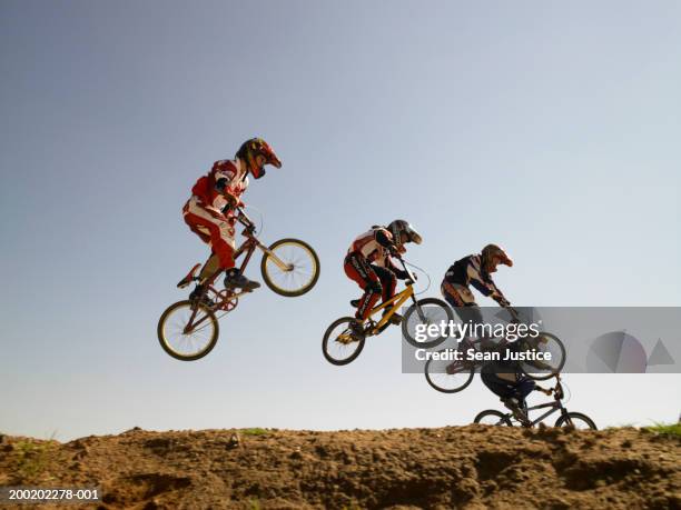 bmx cyclists in competition - bmx cycling stock pictures, royalty-free photos & images