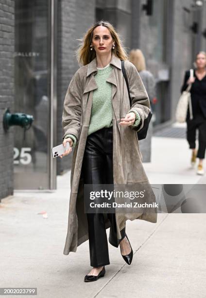 Lauren Santo Domingo is seen wearing a tan trench coat, green sweater, black pants, black shoes with black bag outside the Proenza Schouler show...