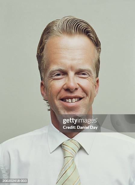 man with enlarged forehead, smiling, portrait (digital enhancement) - big head man stock pictures, royalty-free photos & images