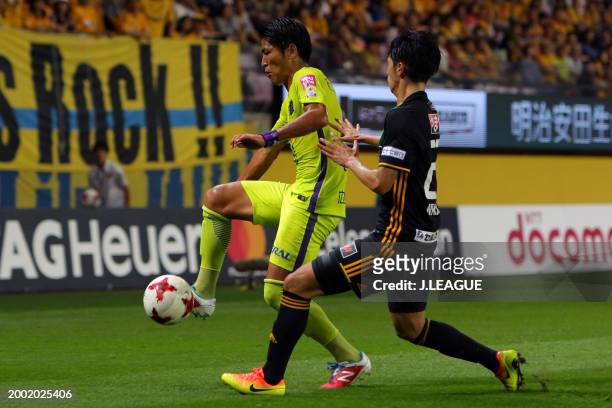 Daiki Niwa of Sanfrecce Hiroshima controls the ball against Yoshihiro Nakano of Vegalta Sendai during the J.League J1 match between Vegalta Sendai...
