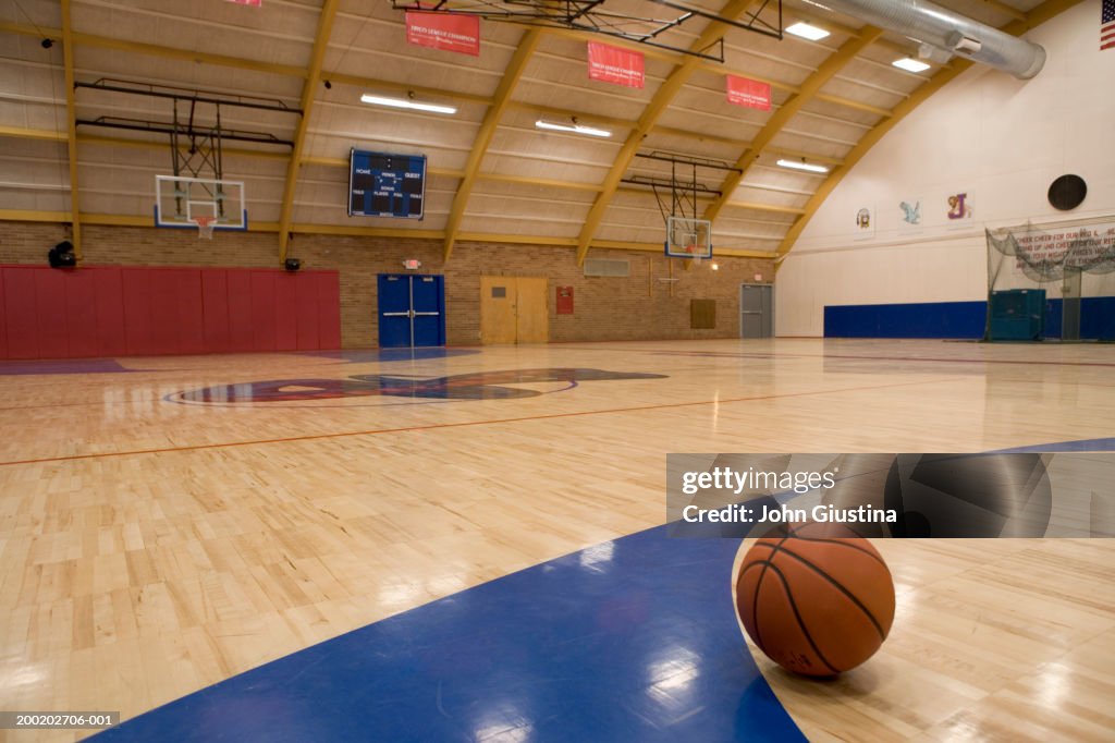 Basketball on gym floor