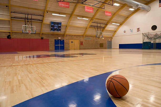 basketball on gym floor - basketball stock pictures, royalty-free photos & images
