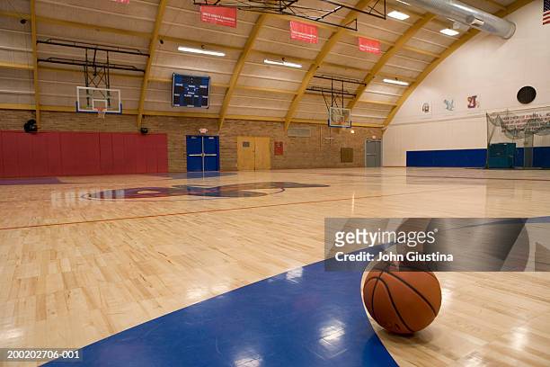 basketball on gym floor - sport venue stock pictures, royalty-free photos & images