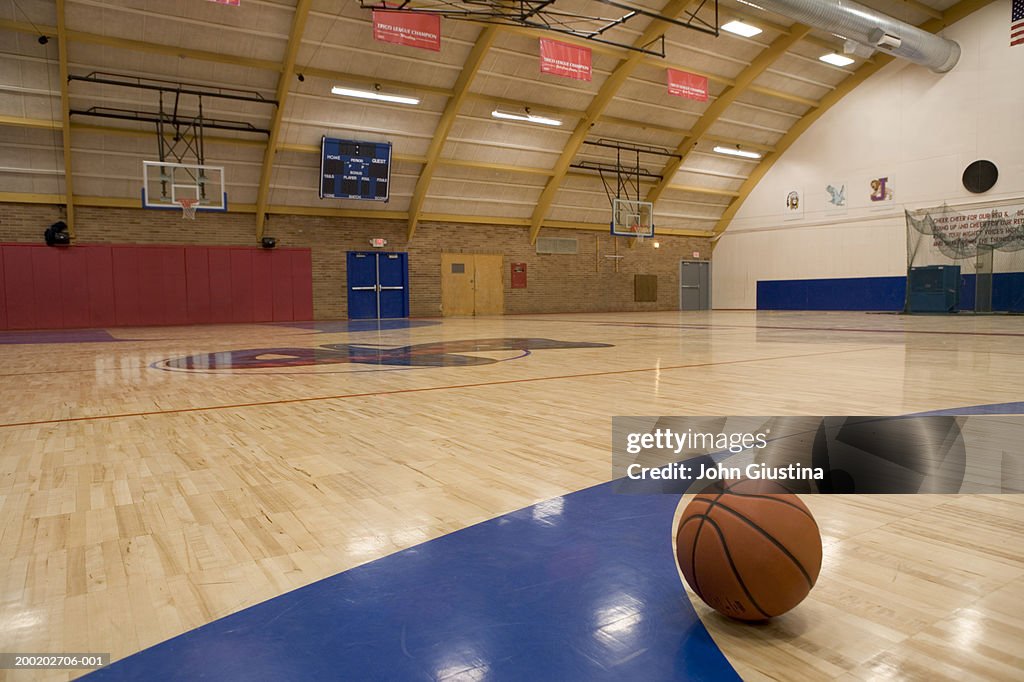 Basketball on gym floor