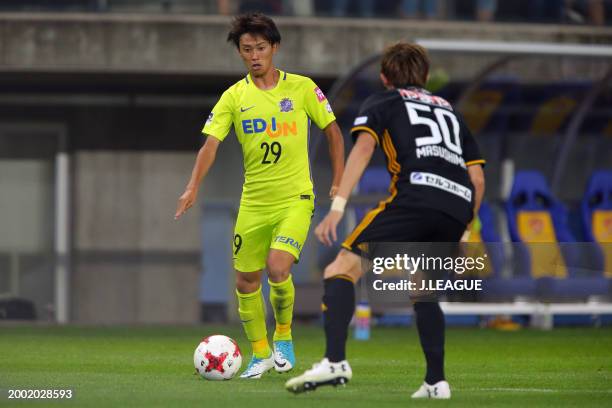 Tsukasa Morishima of Sanfrecce Hiroshima takes on Tatsuya Masushima of Vegalta Sendai during the J.League J1 match between Vegalta Sendai and...