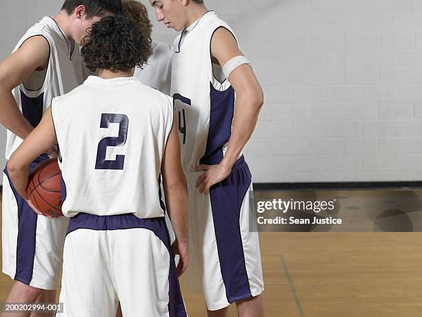 teenage boys (16-18) basketball players in huddle on court - sides 2nd stock pictures, royalty-free photos & images