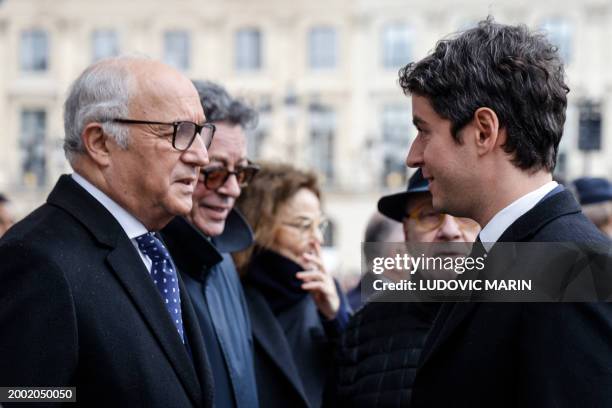 President of the French Constitutional Council, former French Prime Minister Laurent Fabius and France's Prime Minister Gabriel Attal talk as they...