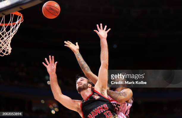 Denzel Valentine of the Kings shoots under pressure from Samson Froling of the Hawks during the round 19 NBL match between Sydney Kings and Illawarra...