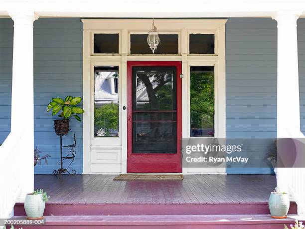 front porch and front door of house - portico sopraelevato foto e immagini stock