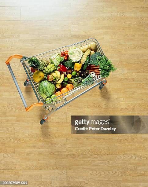 shopping cart filled with fruit and vegetables, overhead view - shopping trolleys stock pictures, royalty-free photos & images