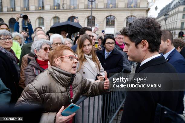 France's Prime Minister Gabriel Attal goes to meet attendees following a national tribute ceremony in honour of former French justice minister Robert...