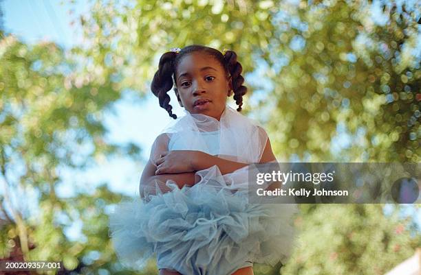 girl (10-12) wearing ballet costume outdoors, portrait, low angle view - tutu stock pictures, royalty-free photos & images