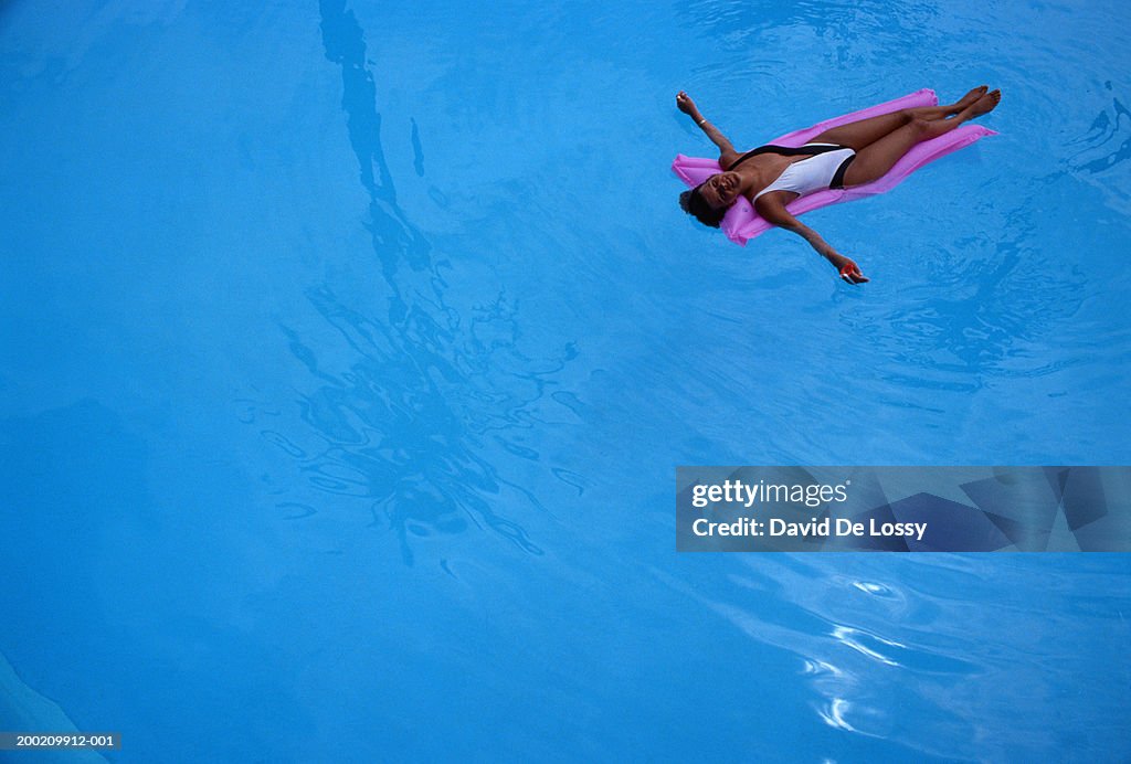 Woman on pink raft
