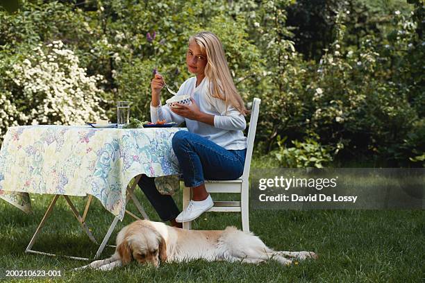 woman eating in the garden - grounds stock pictures, royalty-free photos & images