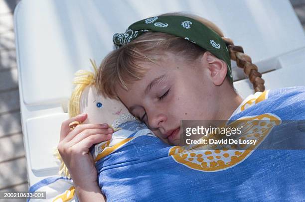 girl asleep at pool - david de lossy sleep stock pictures, royalty-free photos & images