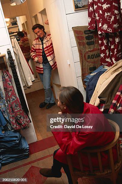 men and women in a dressing room - mens changing room stock pictures, royalty-free photos & images