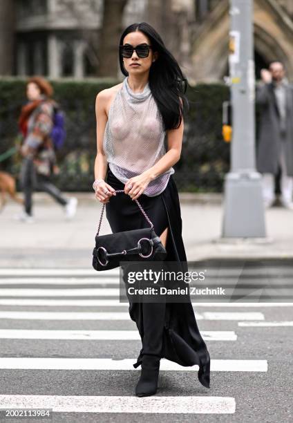 Guest is seen wearing a sheer top, black skirt, black sunglasses and bag outside the LaPointe show during NYFW F/W 2024 on February 10, 2024 in New...