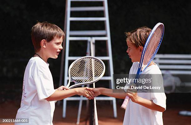 two boy shaking hand - fairness stock-fotos und bilder