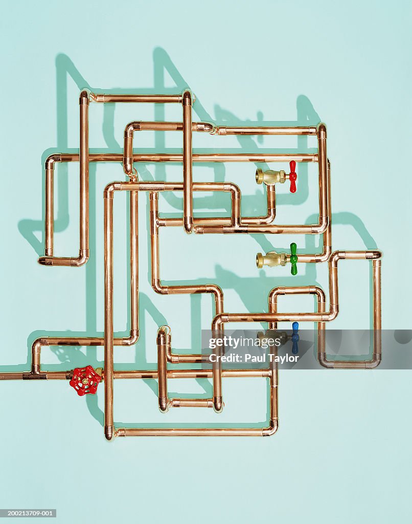Tangle of water pipes and taps
