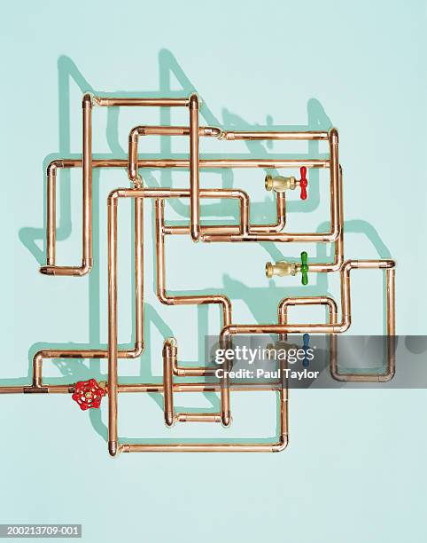 tangle of water pipes and taps - pipe tube stock pictures, royalty-free photos & images