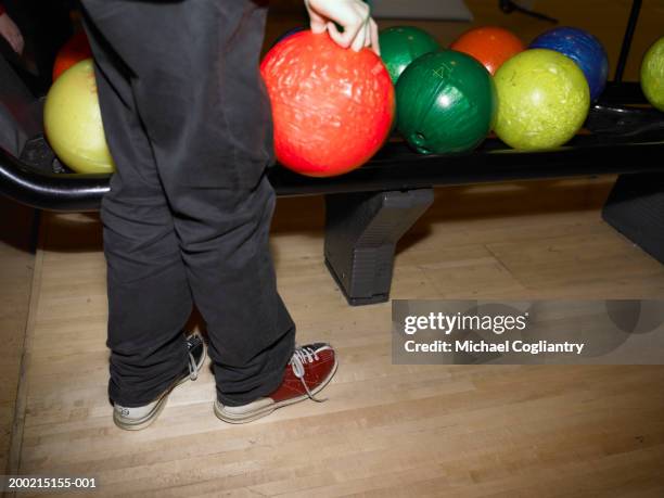 man bowling, low section, side view - bowling shoe stock pictures, royalty-free photos & images