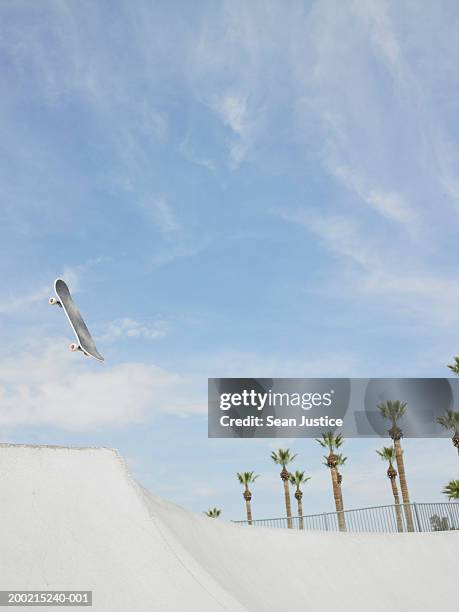 skateboard in air over course - skateboard park stock pictures, royalty-free photos & images