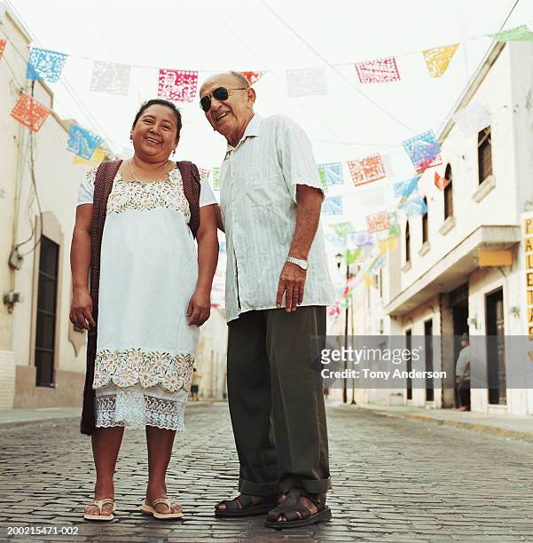 senior man and mature woman on cobblestone street, portrait - mérida mexiko bildbanksfoton och bilder