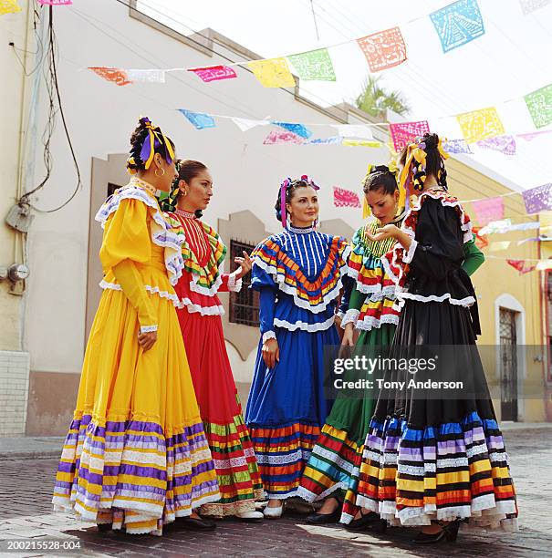 flamenco dancers wearing traditional dress at fiesta - flamenco dancing stock-fotos und bilder