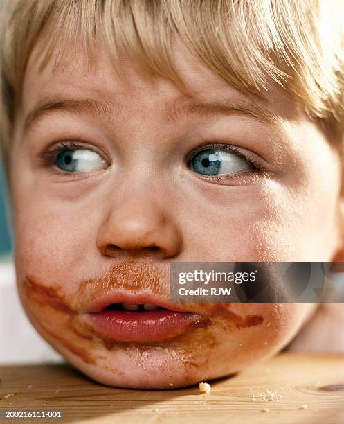 boy (2-4) with food around mouth, close-up - messy kids stock pictures, royalty-free photos & images