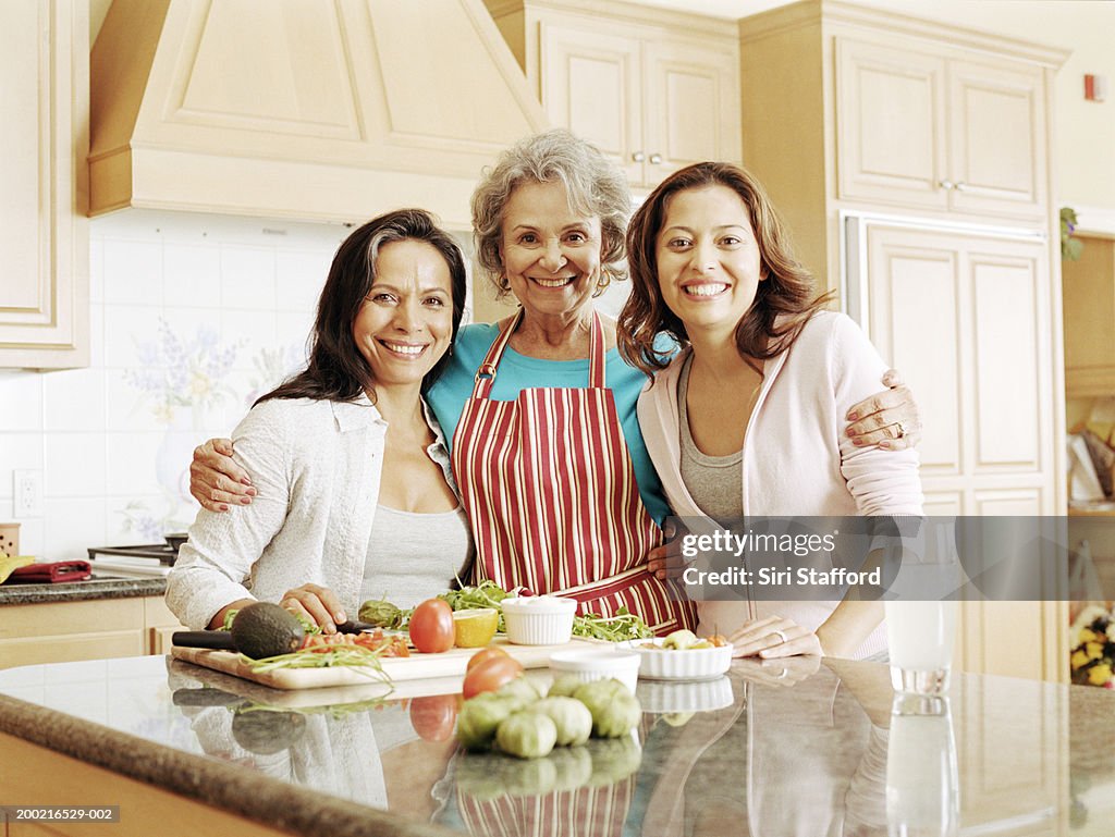 Three generation family preparing food in kitchen, portrait