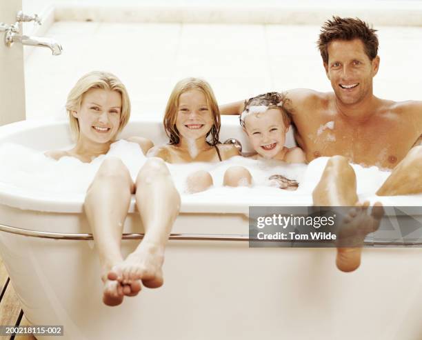 family relaxing in bath (children 6-10), portrait - bathroom arrangement stock pictures, royalty-free photos & images