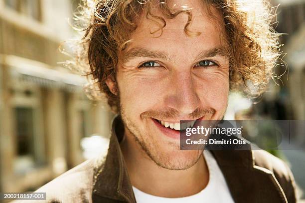 young man smiling, close-up, portrait - langer bart stock-fotos und bilder