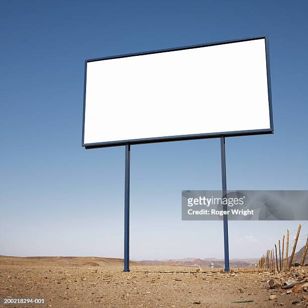 namibia, blank billboard  in desert landscape, low angle view - remote location stock-fotos und bilder